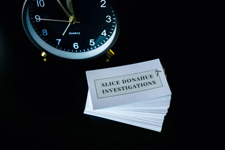 Click and business cards of Alice Donahue Investigations