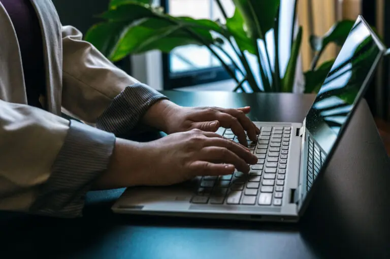 Alice typing a workplace investigation report